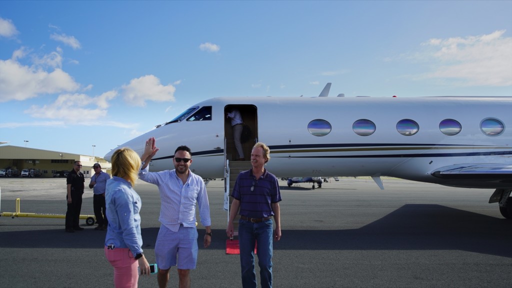 Scientists stand near research aircraft