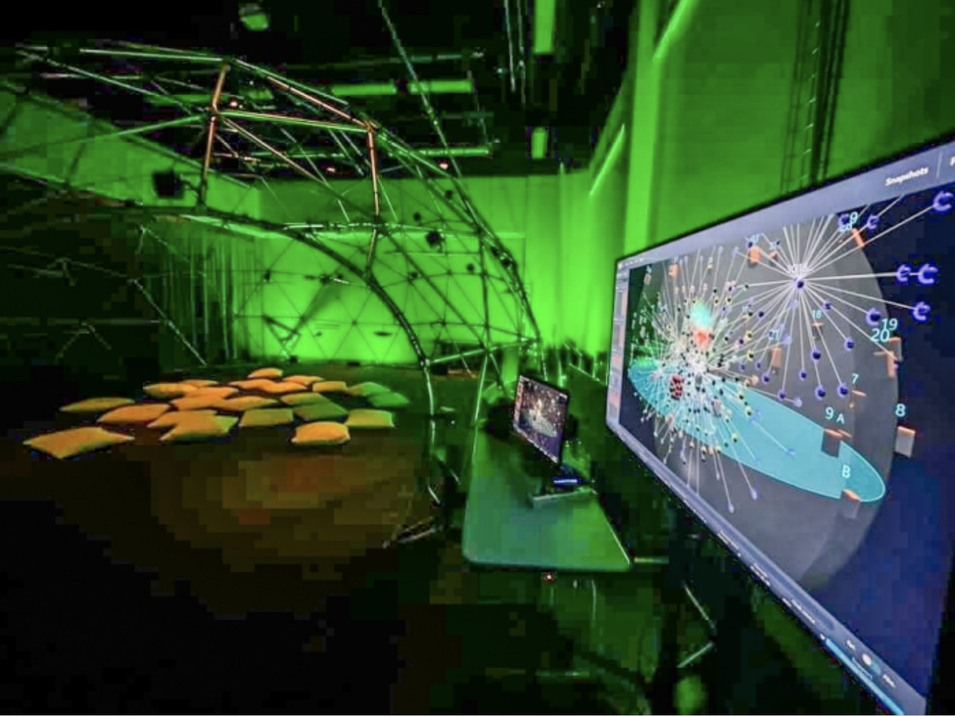 To teach listening skills and boost the benefits of listening, the lab has created an immersive surround-sound dome. The Dome of Arts, Media and Engineering (DAME) boasts 42 loudspeakers that play three-dimensional nature recordings. The computer shows software dispersing sound throughout the dome. Photo courtesy of theÂ&nbsp;Acoustic Ecology Lab