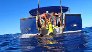 Scientists recover a glider from the field after a mission at sea