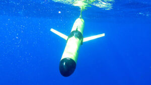 An underwater glider dives beneath the surface of the ocean to collect data