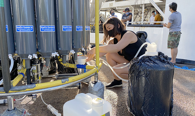 A BIOS intern takes water samples from the CTD aboard the R/V Atlantic Explorer